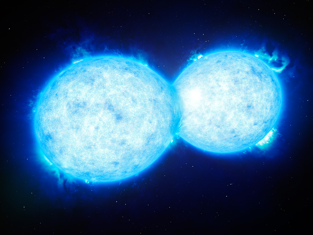 This artist’s impression shows VFTS 352 — the hottest and most massive double star system to date where the two components are in contact and sharing material. The two stars in this extreme system lie about 160 000 light-years from Earth in the Large Magellanic Cloud. This intriguing system could be heading for a dramatic end, either with the formation of a single giant star or as a future binary black hole.